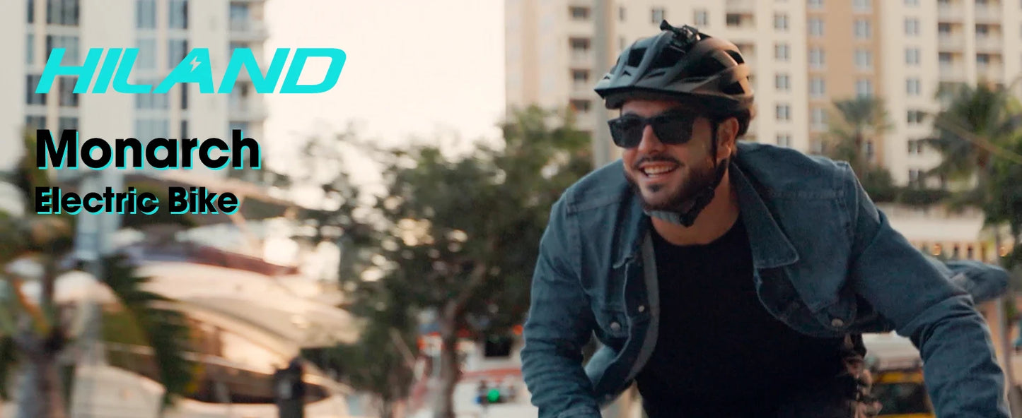 Man riding a bicycle with 'Hiland Monarch Electric Bike' branding in an urban setting.